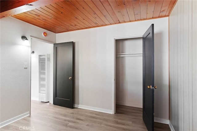 1625 Rose Ave, Merced, CA 95341 - unfurnished bedroom featuring a heating unit, wood ceiling, wood finished floors, and a closet