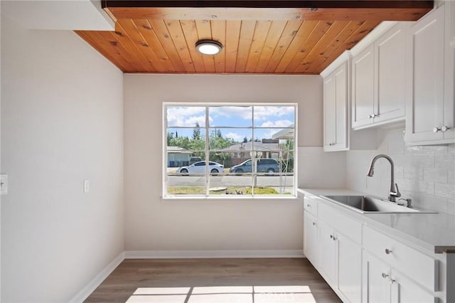 1625 Rose Ave, Merced, CA 95341 - kitchen with plenty of natural light, backsplash, light wood finished floors, light countertops, and wooden ceiling