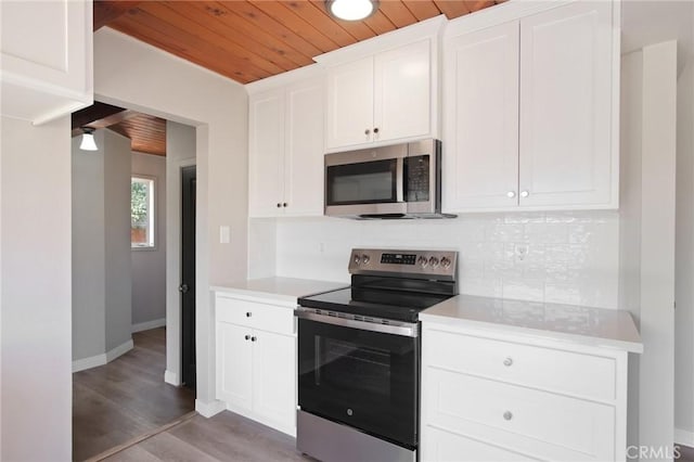 1625 Rose Ave, Merced, CA 95341 - kitchen featuring appliances with stainless steel finishes, wood ceiling, tasteful backsplash, light countertops, and white cabinets