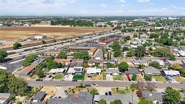1625 Rose Ave, Merced, CA 95341 - aerial overview of property's location featuring a main thoroughfare and nearby suburban area