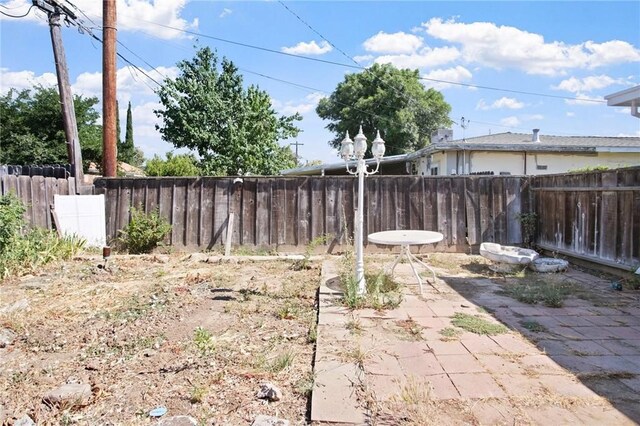 1625 Rose Ave, Merced, CA 95341 - fenced backyard featuring a patio area