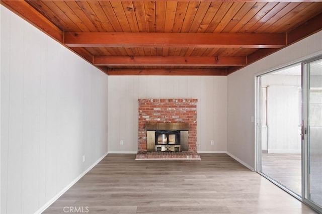 1625 Rose Ave, Merced, CA 95341 - unfurnished living room featuring wood finished floors, a wooden ceiling with exposed beams, and wooden walls