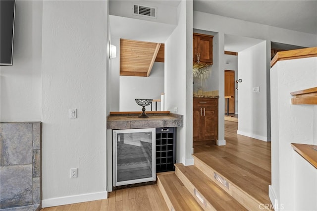 4 Woodhaven, Laguna Niguel, CA 92677 - bar area featuring light wood finished floors and wine cooler
