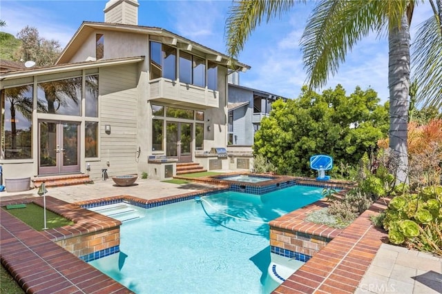 4 Woodhaven, Laguna Niguel, CA 92677 - view of swimming pool featuring french doors, exterior kitchen, a patio, and a pool with connected hot tub