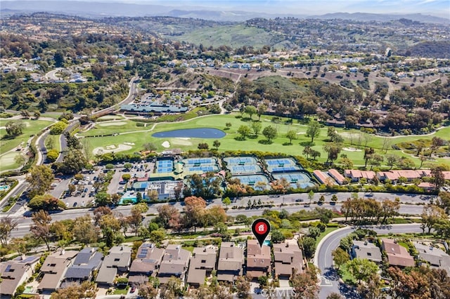4 Woodhaven, Laguna Niguel, CA 92677 - aerial overview of property's location with a golf club, nearby suburban area, and a water and mountain view