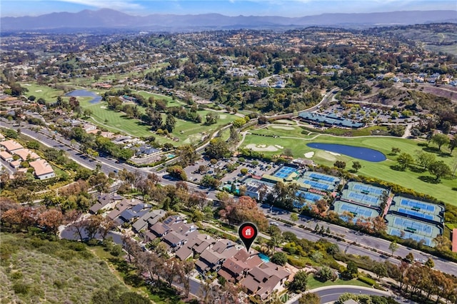 4 Woodhaven, Laguna Niguel, CA 92677 - aerial view of property and surrounding area featuring a local golf course, a water and mountain view, and nearby suburban area