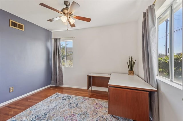 5801 Repetto Ave, East Los Angeles, CA 90022 - home office with wood finished floors and a ceiling fan