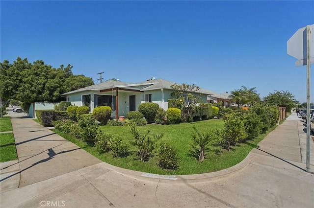 5801 Repetto Ave, East Los Angeles, CA 90022 - view of front facade featuring a front yard