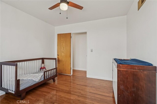 5801 Repetto Ave, East Los Angeles, CA 90022 - bedroom featuring wood finished floors and ceiling fan