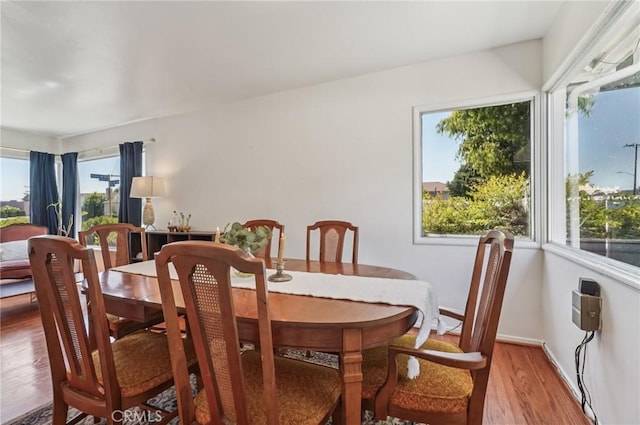 5801 Repetto Ave, East Los Angeles, CA 90022 - dining area with light wood-style flooring and baseboards