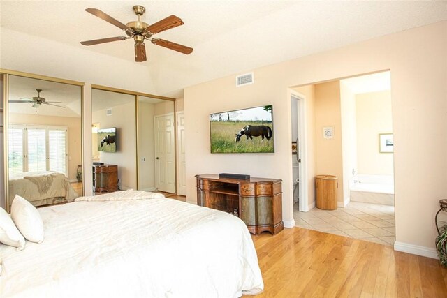 21094 Trailside Dr, Yorba Linda, CA 92887 - bedroom with multiple closets, light wood-type flooring, ensuite bathroom, and ceiling fan