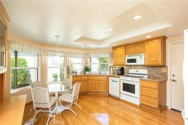 21094 Trailside Dr, Yorba Linda, CA 92887 - kitchen featuring white appliances, a raised ceiling, light wood-type flooring, tasteful backsplash, and recessed lighting