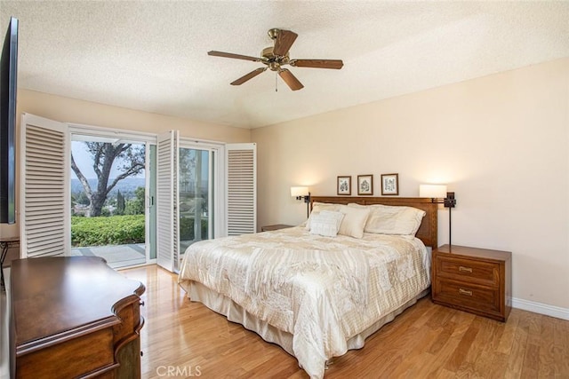 21094 Trailside Dr, Yorba Linda, CA 92887 - bedroom featuring access to exterior, light wood-type flooring, a textured ceiling, and a ceiling fan