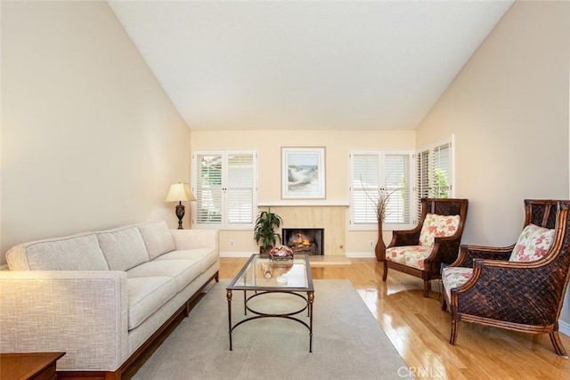 21094 Trailside Dr, Yorba Linda, CA 92887 - living room with vaulted ceiling, light wood-style floors, and a premium fireplace