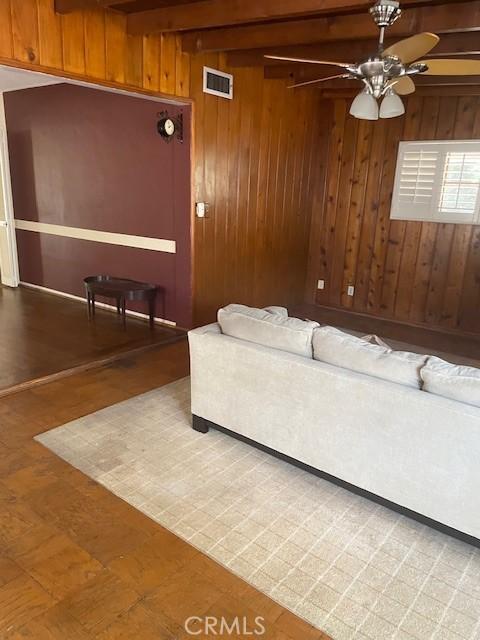602 N Griffith Park Dr, Burbank, CA 91506 - living room with ceiling fan, wood walls, and beam ceiling