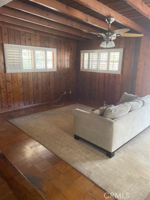 602 N Griffith Park Dr, Burbank, CA 91506 - living area with healthy amount of natural light, beam ceiling, wooden walls, and a ceiling fan