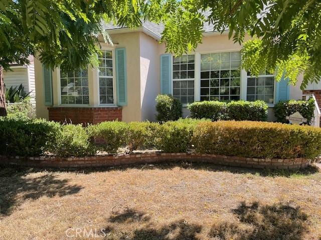 602 N Griffith Park Dr, Burbank, CA 91506 - view of side of home featuring stucco siding and brick siding