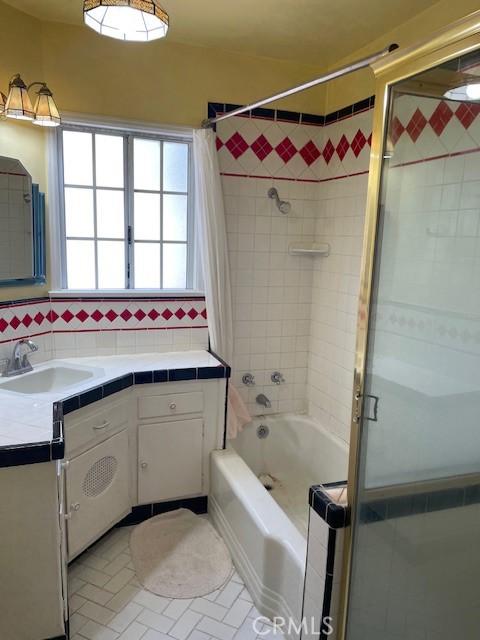 602 N Griffith Park Dr, Burbank, CA 91506 - full bathroom with vanity, shower / bath combination with curtain, and tile patterned flooring