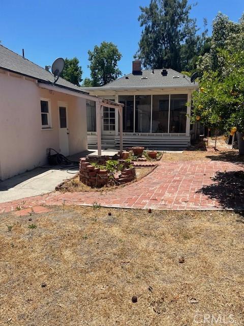 602 N Griffith Park Dr, Burbank, CA 91506 - back of house with a patio area, stucco siding, and a sunroom