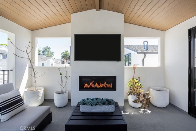 7141/2 Iris Ave, Newport Beach, CA 92625 - living area with lofted ceiling, a warm lit fireplace, and wooden ceiling