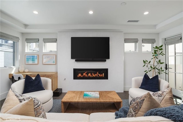 7141/2 Iris Ave, Newport Beach, CA 92625 - living room with a tray ceiling, wood finished floors, a glass covered fireplace, and recessed lighting