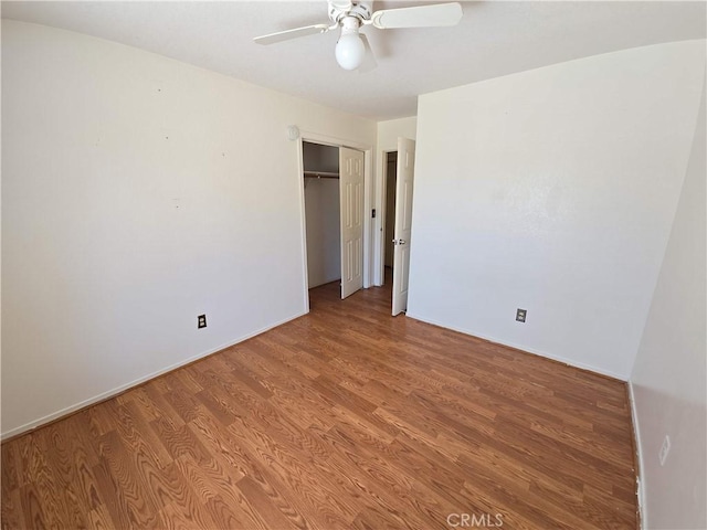 568 Walnut Ct, Kerman, CA 93630 - unfurnished bedroom with light wood-style flooring, a closet, and ceiling fan