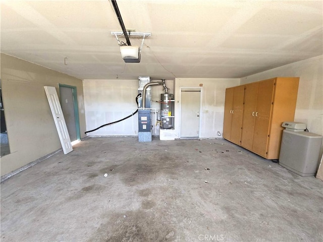 568 Walnut Ct, Kerman, CA 93630 - garage with strapped water heater, a garage door opener, and heating unit