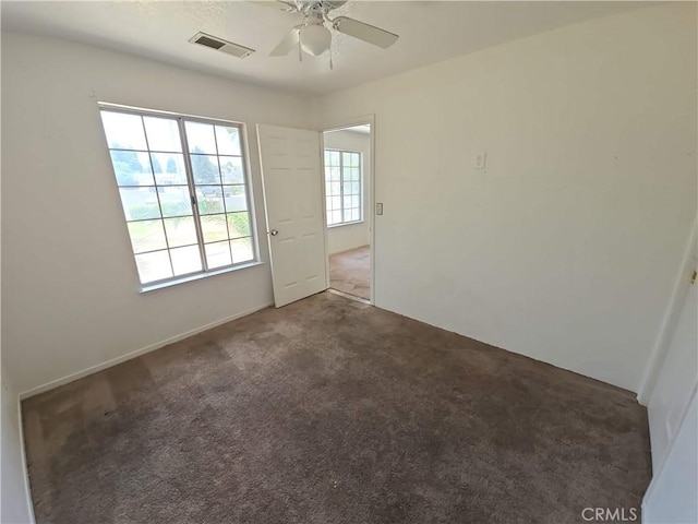 568 Walnut Ct, Kerman, CA 93630 - empty room with a ceiling fan and carpet flooring