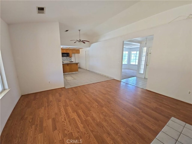 568 Walnut Ct, Kerman, CA 93630 - unfurnished living room featuring light wood-type flooring and ceiling fan