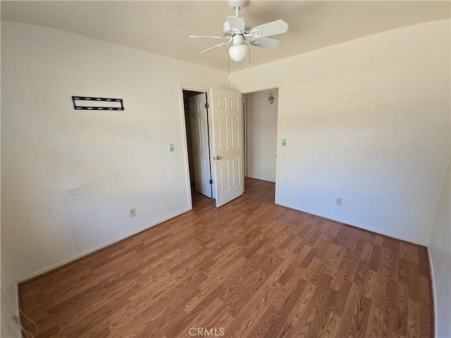568 Walnut Ct, Kerman, CA 93630 - empty room with a ceiling fan and wood finished floors