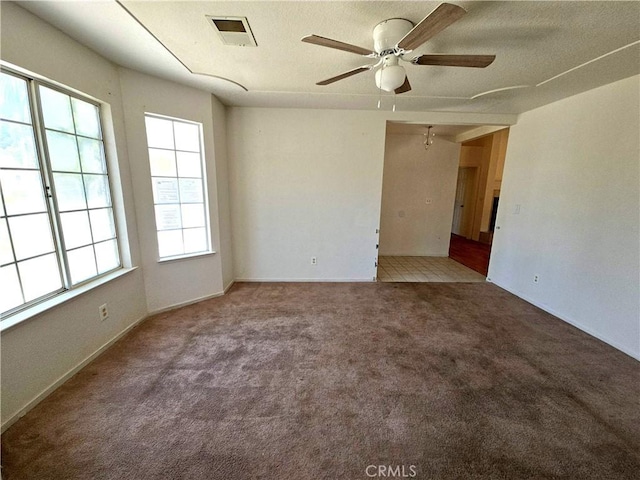 568 Walnut Ct, Kerman, CA 93630 - empty room with a ceiling fan and carpet