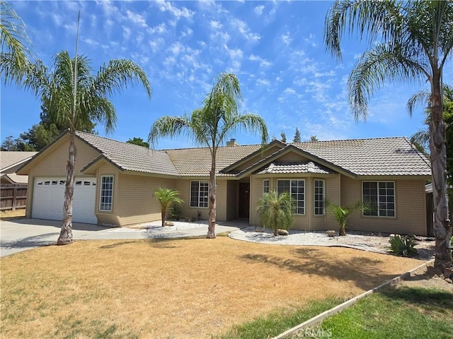 568 Walnut Ct, Kerman, CA 93630 - single story home featuring a tiled roof, a garage, and concrete driveway