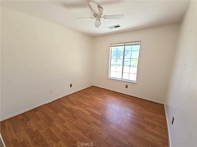 568 Walnut Ct, Kerman, CA 93630 - unfurnished room with wood finished floors and ceiling fan