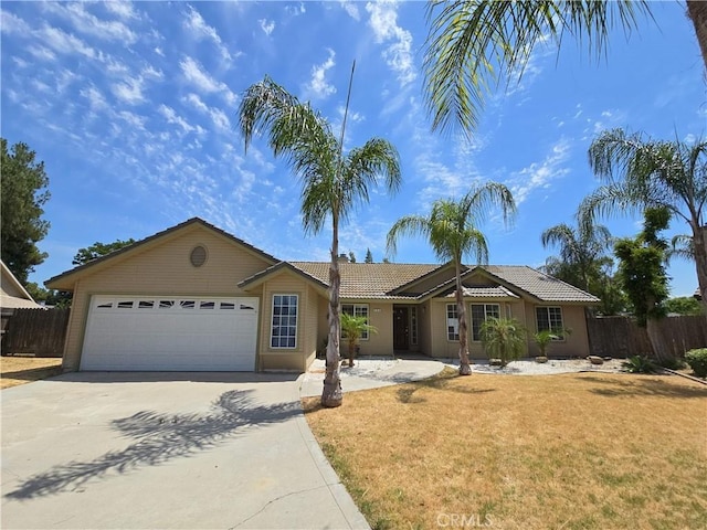 568 Walnut Ct, Kerman, CA 93630 - ranch-style home featuring concrete driveway, a garage, and a tile roof