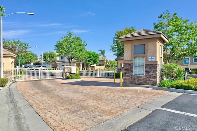 8305 Highridge Pl, Rancho Cucamonga, CA 91730 - view of home's community with a gate