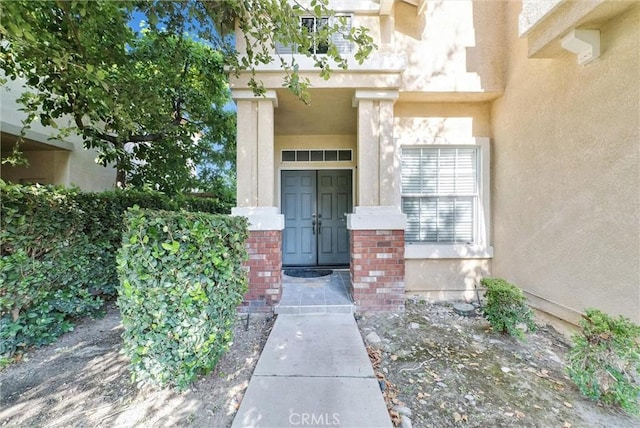 8305 Highridge Pl, Rancho Cucamonga, CA 91730 - property entrance featuring brick siding and stucco siding