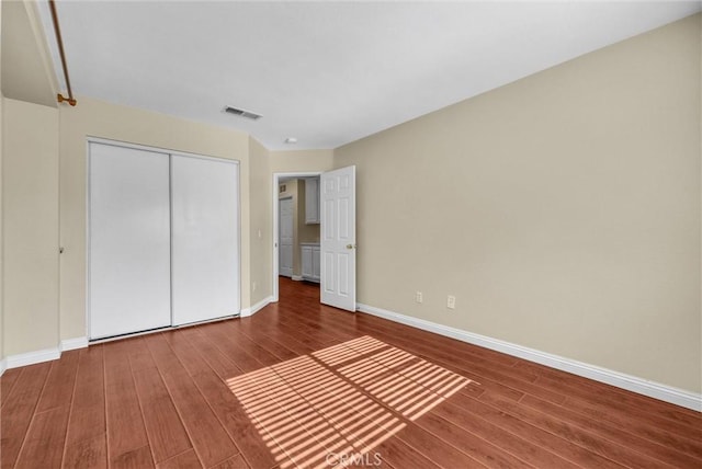 8305 Highridge Pl, Rancho Cucamonga, CA 91730 - unfurnished bedroom featuring wood finished floors and a closet