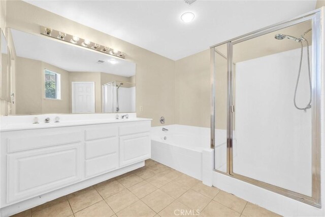 8305 Highridge Pl, Rancho Cucamonga, CA 91730 - full bathroom featuring a stall shower, a bath, double vanity, and tile patterned floors