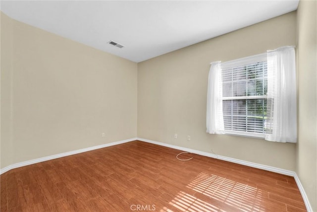 8305 Highridge Pl, Rancho Cucamonga, CA 91730 - empty room with wood finished floors and baseboards