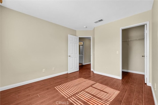 8305 Highridge Pl, Rancho Cucamonga, CA 91730 - unfurnished bedroom featuring wood finished floors, a closet, and a spacious closet