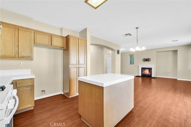 8305 Highridge Pl, Rancho Cucamonga, CA 91730 - kitchen with tile countertops, range, arched walkways, and dark wood-style floors