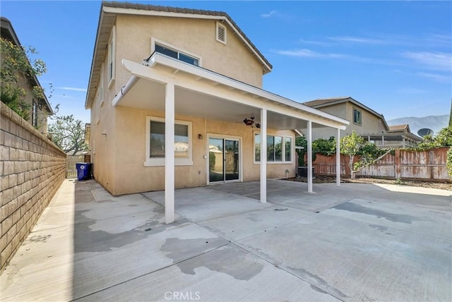 8305 Highridge Pl, Rancho Cucamonga, CA 91730 - back of property featuring stucco siding, ceiling fan, and a patio