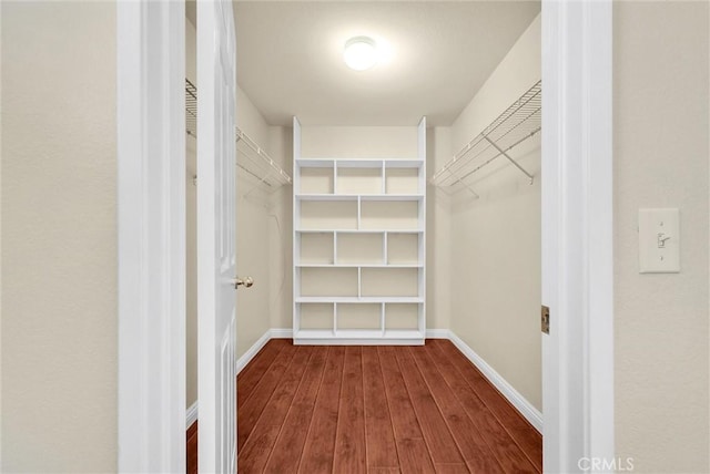 8305 Highridge Pl, Rancho Cucamonga, CA 91730 - walk in closet featuring dark wood-style flooring