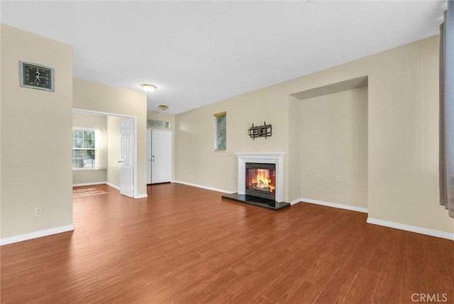 8305 Highridge Pl, Rancho Cucamonga, CA 91730 - unfurnished living room featuring wood finished floors and a glass covered fireplace