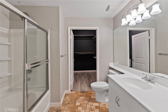 1801 E Katella Ave Unit 1091, Anaheim, CA 92805 - full bathroom with stone finish flooring, vanity, enclosed tub / shower combo, a chandelier, and a walk in closet
