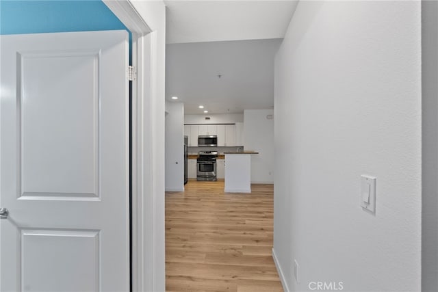1801 E Katella Ave Unit 1091, Anaheim, CA 92805 - hall with light wood finished floors and recessed lighting