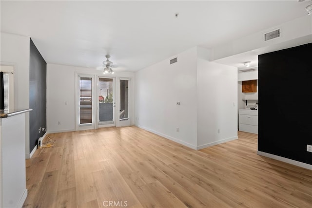 1801 E Katella Ave Unit 1091, Anaheim, CA 92805 - unfurnished living room with light wood-type flooring and ceiling fan