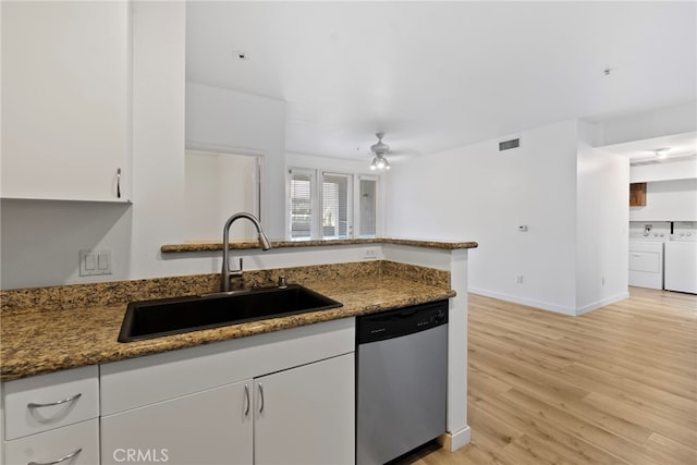 1801 E Katella Ave Unit 1091, Anaheim, CA 92805 - kitchen featuring dishwasher, independent washer and dryer, white cabinets, light wood-type flooring, and a ceiling fan