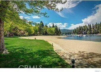 27657 Peninsula Dr, Lake Arrowhead, CA 92352 - view of community featuring a water view and a yard