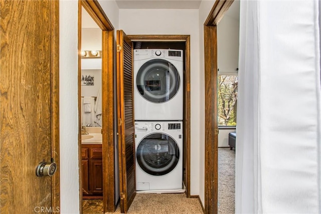27657 Peninsula Dr, Lake Arrowhead, CA 92352 - laundry area featuring stacked washer / dryer and carpet floors